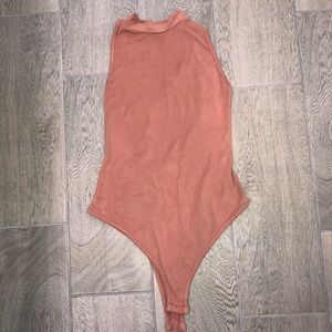 Cross back body suit